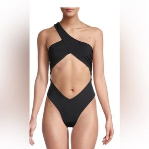 Asymmetrical cross-over one piece bathing suit.